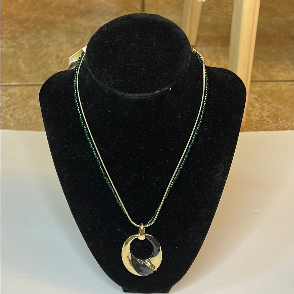 Elegant Gold and Black Pendant Necklace with green beads